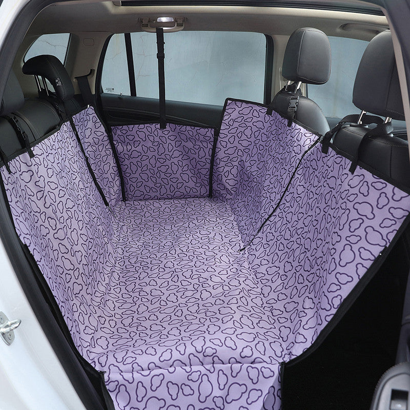 Purple dog car back seat cover installed across a rear seat