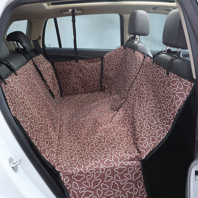 Brown dog car back seat cover installed across a rear seat