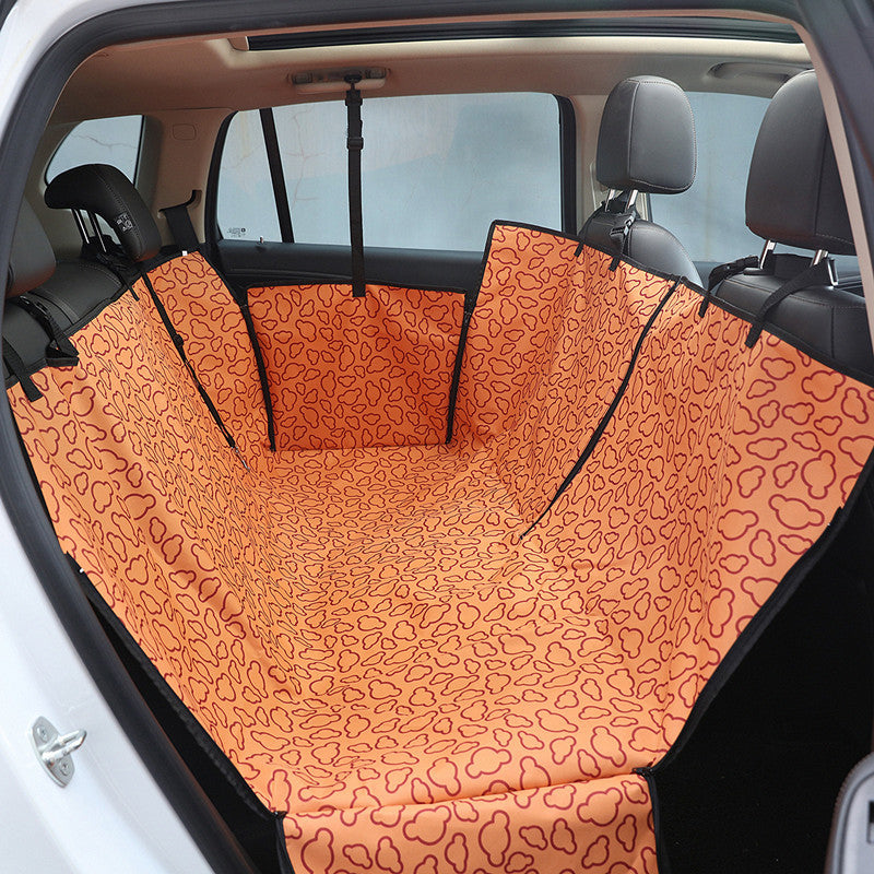 Orange dog car back seat cover installed across a rear seat